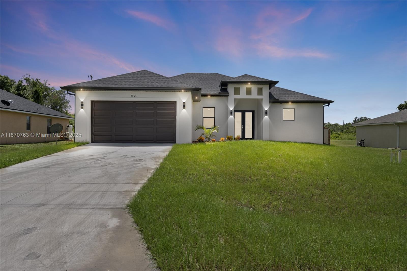 Completed in April 2025, this brand-new 3-bedroom + Den, 2.5-bath home in Lehigh Acres offers modern design and functional living. The Den can serve as a 4th bedroom, while the open floor plan highlights 10' ceilings and 11' coffered accents in the living and primary suites. The kitchen features quartz countertops, stainless steel appliances, and a large island. The primary suite includes a double vanity, walk-in shower, and private water closet. Tile flooring extends throughout with hurricane-rated bronze windows and doors. On a 0.25-acre lot with sprinkler system, covered lanai, exterior half bath, and wide sliders for indoor-outdoor living. A 2-car garage, laundry room, security pre-wiring, and location near SR 82 complete this home. Seller may contribute to closing costs.
