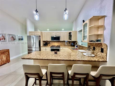 Tiny photo for 9021 NW 150th Ter, Miami Lakes, FL 33018 (MLS # A12077706)