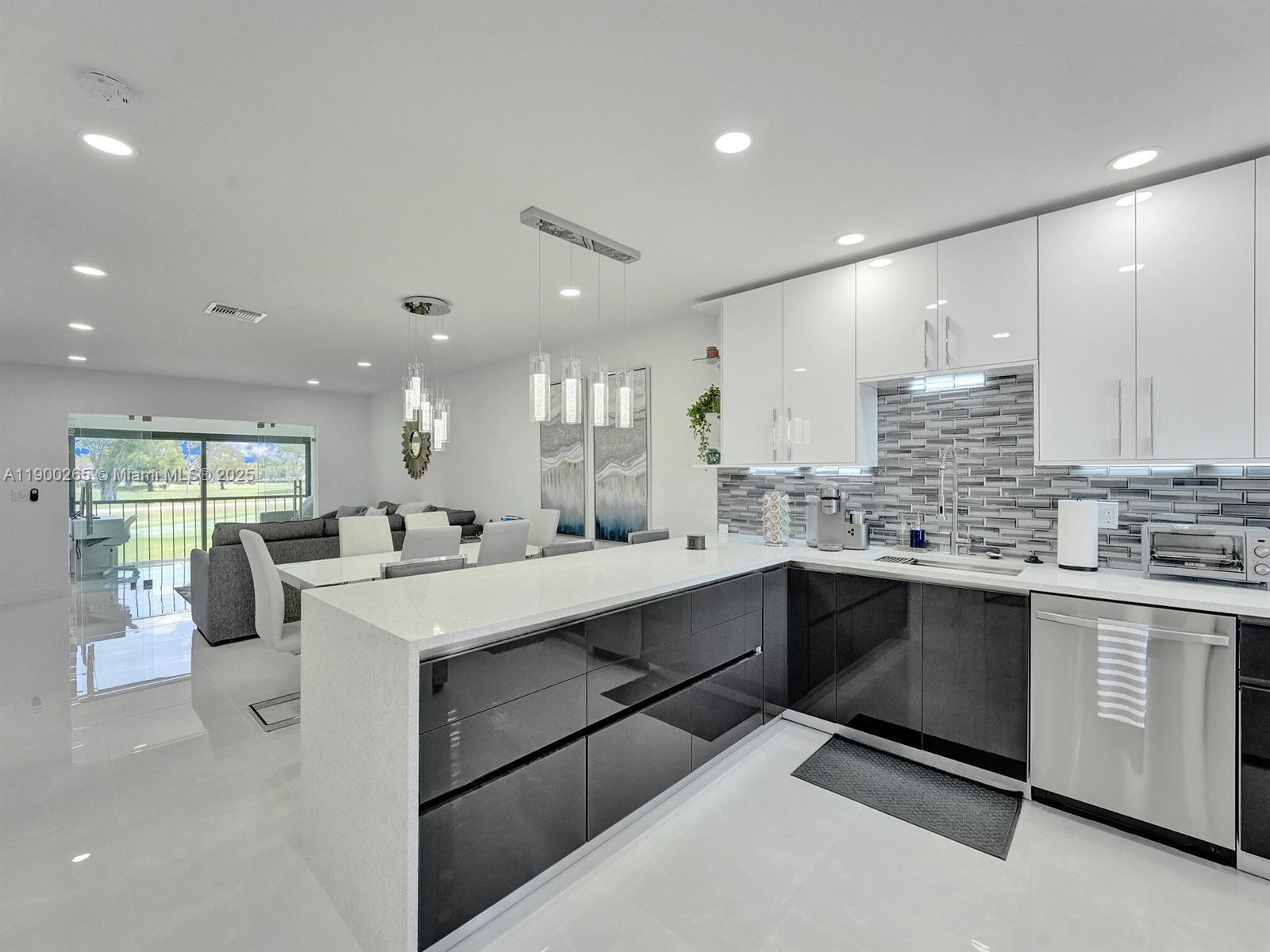 Completely remodeled in 2022 . 2 bedrooms, 2 full bathrooms. Furniture is included in the sale. Contemporary open kitchen with granite countertops. Stainless steel appliances. Full size washer & dryer in bathroom. Plantation shutters in both bedrooms and kitchen. Glass enclosed patio with golf course view. Move in ready designer condo with No mandatory Membership required. New Roof in 2020. AC 2019 (Rheem 2.5 tons) Water heater 2022 (Rheem)Boca Lago is an active 55+ community. Non-mandatory club membership is available. Boca Lago is a non-equity club that offers all the benefits and prestige of a golf and country club lifestyle without excessive initiation fee