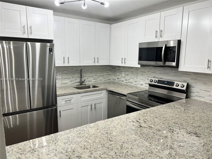 BEAUTIFUL AND RENOVATED unit on the first floor, patio has nice green view, Great West Boca Location, easy access to Roadways, shopping, parks, good schools. Community pool, tennis courts and library. ENJOY THE BOCA LIFESTYLE