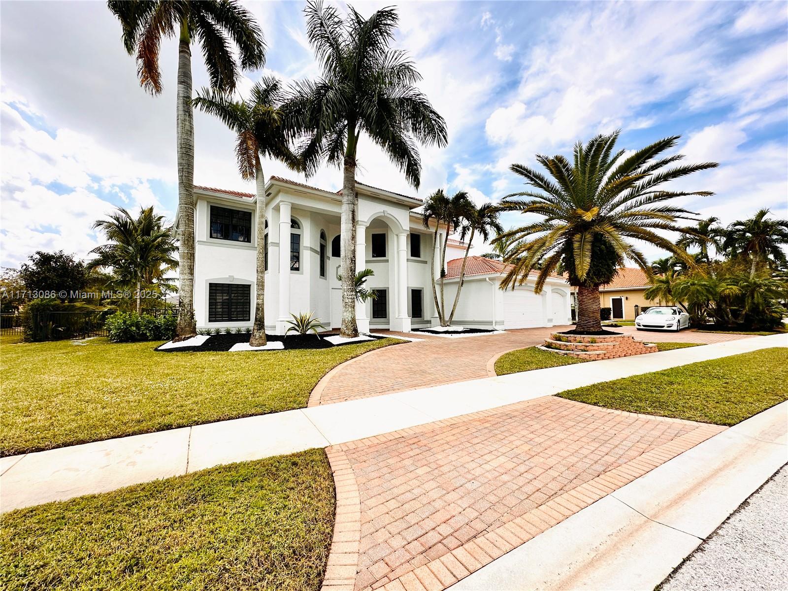 Nestled in a prestigious waterfront lot in Riverstone, Davie's premier gated community, this property 6-bedroom, 4.5 -bathroom two story single-family sits on a 35,248 sqft, redefines luxury living with its seamless blend of modern sophistication and warm family charm. The home boasts an airy, open-concept design with big 48x48 Italian porcelain floors
A state-of-the-art smart toilet system in every spa-inspired bathroom elevates daily routines with features like heated seats, automatic cleaning, and customizable settings. Unique architectural elements create versatile spaces perfect for work, play, and relaxation, showcasing the latest in cutting-edge interior design trends.
All of this is set in a welcoming neighborhood filled with parks, excellent schools. Low hoa fees