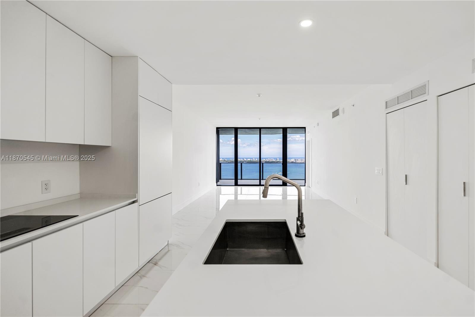 Waterfront living in this brand-new 1,838 sqft residence featuring a private foyer, 2 bedrooms plus a den. This home includes two assigned garage parking spaces conveniently located between the third and fourth floors. Floor-to-ceiling 10-ft impact glass windows frame breathtaking direct Biscayne Bay and ocean views. Aria Reserve offers an unparalleled lifestyle with resort-style amenities: a semi-Olympic pool, state-of-the-art fitness center, wine lounge, party room, tennis & paddle courts, mini-golf, kids’ play area, cabanas, business center, and a secured lobby.
Perfectly situated in Miami’s vibrant Edgewater neighborhood, you’re just minutes from Wynwood, the Design District, and Miami Beach.