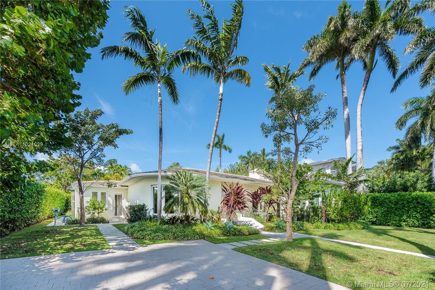 Secluded tropical paradise sited on an oversized 11,250-SF lot on exclusive Venetian Islands! Exquisitely remodeled in 2018 by NY-based architect Jack Wettling and leading colorist Eve Ashcraft, this one-story 5-bed 5-bath mid-century home is finished with nature-inspired color palette blending modern living into the lush surroundings of Venetian Islands. Inside, beautifully appointed open living spaces enhanced by exposed wood beams, oak floors, custom built-ins, modern kitchen, and sliding glass door that completely opens allowing flawless integration between the indoors and outdoors. Outside, IPE deck and several lounging areas surround the pool. Gated property with new roof, electric, plumbing, A/C, & water heater. Upgraded with Sonos system, Lutron lighting.