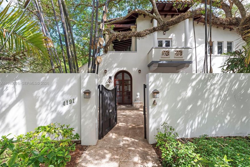 Mediterranean-style residence showcasing timeless architecture that seamlessly blends European refinement with classic Mediterranean elegance. Designed and built by renowned South Florida architect Ralph Portuondo, this home is rich in refined details, including natural oak wood floors and solid mahogany doors throughout.
The front yard is a true sanctuary, featuring a Japanese-inspired garden framed by mature live oak trees and a 65-foot swimmer’s lap pool, all fully enclosed by a walled fence to ensure complete privacy.
Perfectly positioned on the corner of Lybyer Avenue and historic LeJeune Road, the property offers the rare balance of central convenience and tranquil seclusion. Just minutes from top-tier schools, premier shopping, and fine dining, this home presents an exceptional opportunity to entertain, work, and raise a family in an urban paradise.