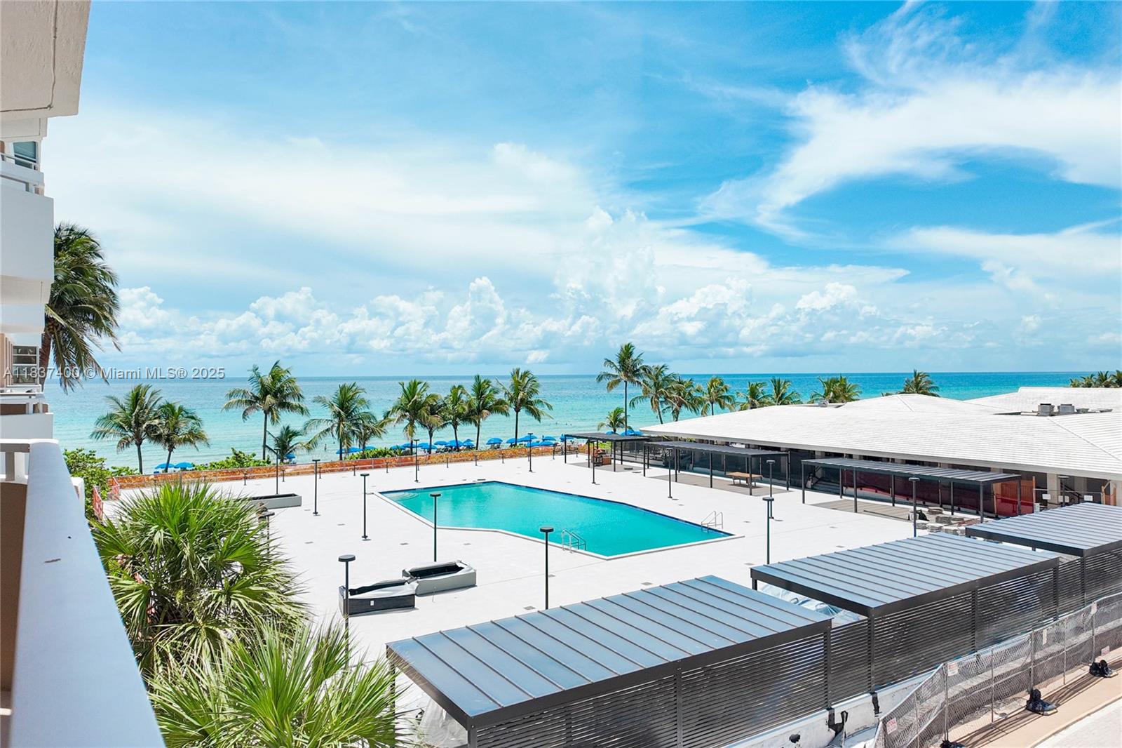 Step into this beautifully renovated 2-bedroom, 2-bathroom apartment featuring porcelain flooring throughout and a sleek, modern kitchen with modern finishes. This furnished, south-facing unit offers tranquil pool and ocean views from a low floor, blending comfort with style. Enjoy impact windows and doors for peace of mind and energy efficiency. Every detail has been thoughtfully updated to create a bright, modern coastal home. The Hemispheres offers resort-style amenities: beach access, pools, tennis courts, fitness centers, marina, on-site dining, and more.