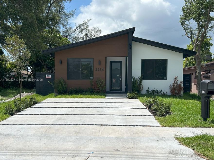 NEW CONSTRUCTION! This spectacular new property is situated 1 mile to Dania Point, 3 miles to Fort Lauderdale Airport, 3 miles to the beach. This remarkable 1,826 SF masterpiece offers 1,698 SF of A/C one-story floor plan, 4 bedrooms and 3 and half bathrooms, providing impressive ceiling heights of up to 9’, doors at 8’. Italian tile throughout . The open format kitchen is completely equipped with Whirlpool appliances, laundry room in AC area, outdoor patio, among many other features. Make this jewel your future home!