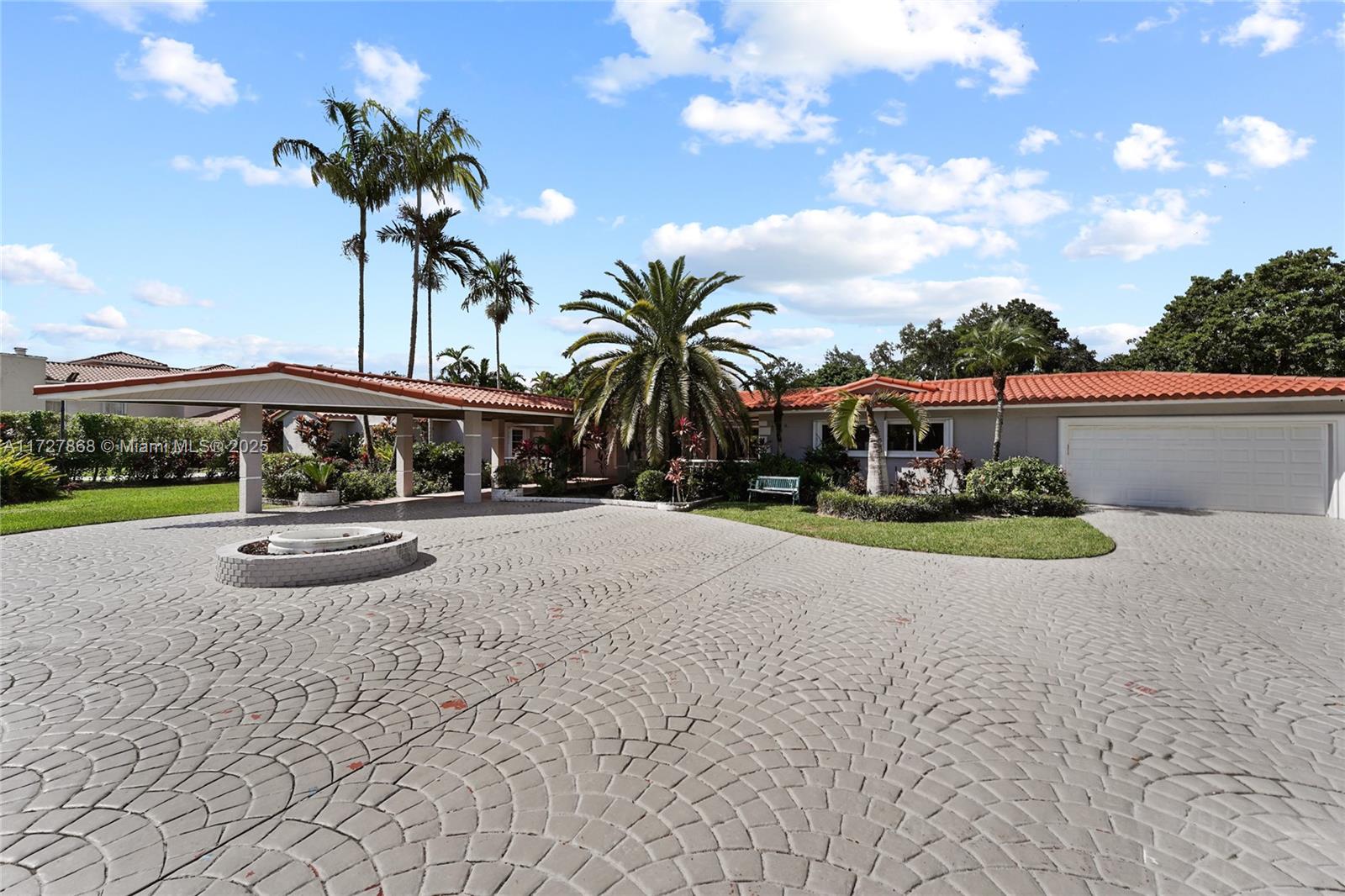 Price Drop Alert – Pinecrest Luxury Estate on Over an Acre. Experience the ultimate in South Florida living with this gated 1.02-acre Pinecrest estate. Spanning 6,053 sq ft, this 5-bed, 6.5-bath ranch-style home stuns with soaring spaces, a chef’s dream kitchen (2017), and a tranquil primary suite with pool views and an oversized walk-in closet. Step into your private resort — a sparkling pool, fruit trees, lush gardens, and a serene pond with waterfall await. Added perks: second kitchen, 65kw generator, and newer roof (2019). Whether you’re an end-user craving luxury, an investor seeking value, or a developer with vision, this is your moment. Opportunities like this in Pinecrest don’t come twice — schedule your private tour today before it’s gone!