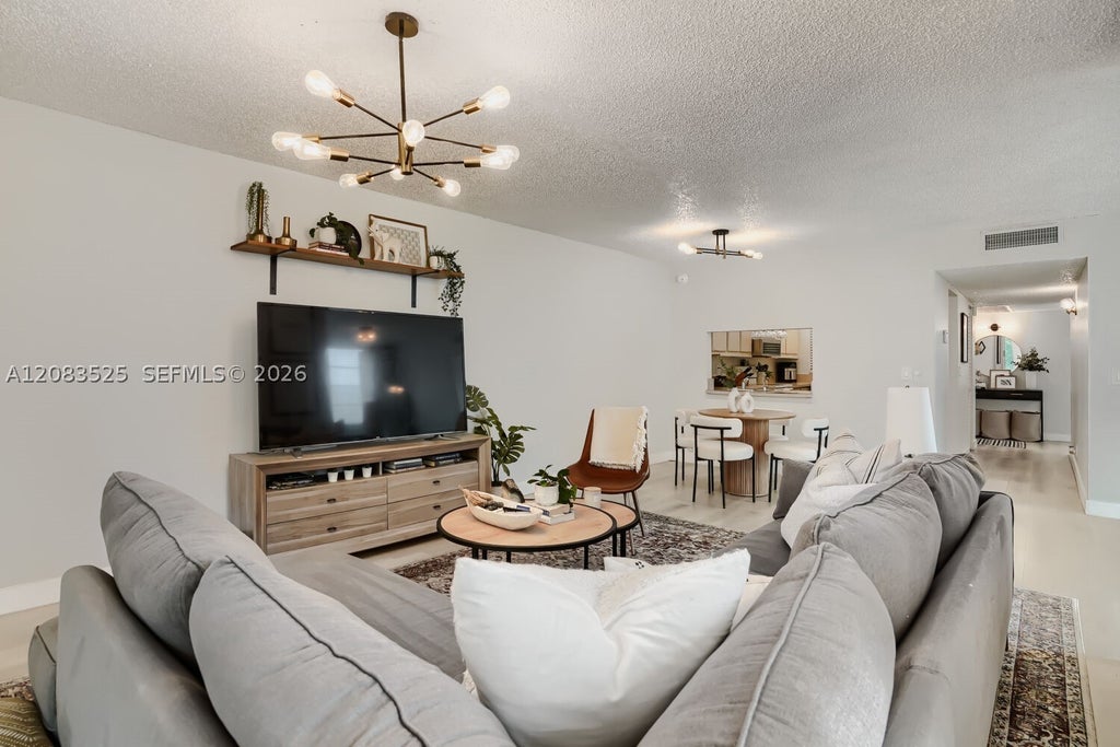 Photo of 9311 Orange Grove Dr #316, Davie, FL 33324 (MLS # A12083525)