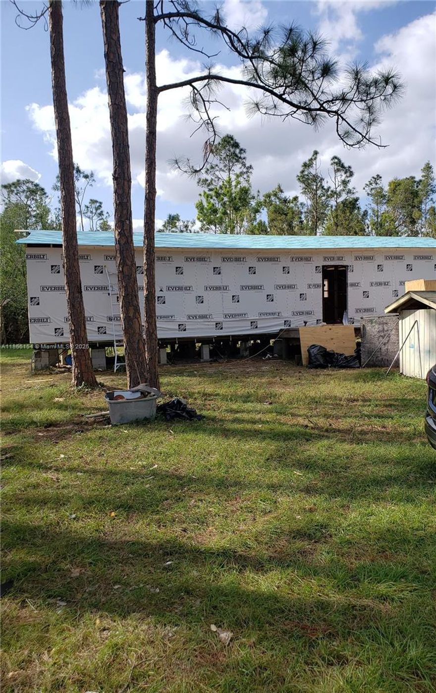 This is a distressed manufactured home and will require considerable improvements or removal. The property is over 3/4 of an acre and abuts a currently wooded area providing abundant privacy and quiet. Located in unrestricted LEE County (North Fort Myers) this oversized lot with electric, well, septic and paved driveway is a recreational vehicle owner's dream! Home is currently uninhabitable. Investment Opportunity for a rural feel, with the accommodations of the City.
This property has county violations and is being sold AS-IS. Buyer to do their own due diligence.