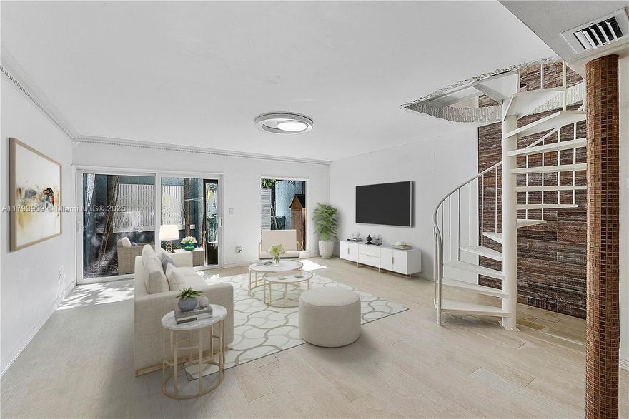 Welcome to your dream residence, a stunning 2 bedroom modern Townhome, minutes  away from the vibrant Miami Design District. This 2 story gem seamlessly blends contemporary design with functional living. Step inside to discover an open concept living space featuring sleek finishes and abundant natural light. The gourmet kitchen, equipped with top of the line appliances and elegance, flows effortlessly into the spacious living and dining areas, perfect for entertaining or relaxing. Upstairs, you'll find 2 generously sized bedrooms, each offering comfort and style, with ample closet space and modern bathroom & half  bath . Enjoy your private patio, with its own private entrance, this TH offers both privacy, common areas pool & spa.