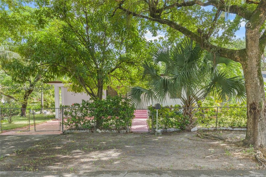 Comfort & convenience in this quiet North Miami home. Single-story w/ peace of mind: new roof, new A/C, & hurricane impact windows. Open-concept living/dining/kitchen. Main home has 2 beds, 1 bath, plus large separate in-law quarters (192 sq ft) w/ private entry and its own bath—perfect for guests or a home office. Also features a large utility/storage room (120 sq ft).

Outdoors, a 7,538 sq ft lot w/ fully fenced yard. Enjoy 3 outdoor spaces: screened porch (96 sq ft), covered patio (144 sq ft), & front porch (52 sq ft). Large driveway.

Centrally located: Mins to I-95, 15 mins to beach, moments to Barry University, shopping, & NoMi Village. Incredible opportunity for a first-time buyer or savvy investor.