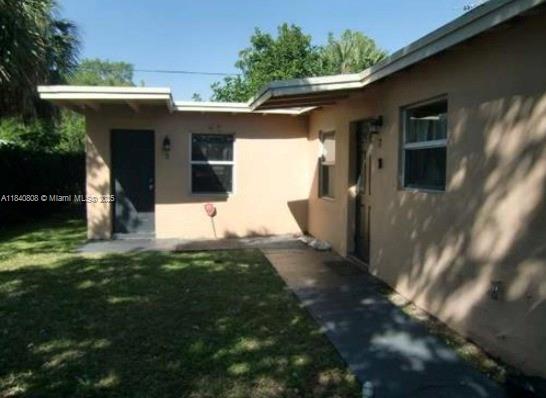 Charming 1-bedroom, 1-bathroom unit available for rent in a quiet Fort Lauderdale neighborhood. This well-maintained residence features a bright living space, a fully equipped kitchen with refrigerator and microwave, and a functional bathroom with bathtub and shower curtain. The bedroom offers comfort and natural light. Enjoy a grassy yard with a mango tree in a peaceful setting. Water is included—ideal for tenants seeking simplicity, comfort, and tranquility.