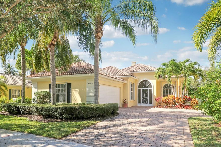 Welcome to this beautiful updated DiVosta-built home in the gated community of Magnolia Bay in Palm Beach Gardens. Lakefront Oakmont Extended Model - Custom Pool with beautiful, lush landscaping with tranquil lake views. Open design custom kitchen with granite countertops, large center island and newer appliances. The 3 Bedrooms, 2 Baths +Den and 2,221 sf living area to suit your lifestyle. Hardwood floors, crown molding and plantation shutters. Split-bedroom floor plan adds flexibility and privacy, laundry room and two-car garage. Accordion Shutters throughout. This Community features a Clubhouse, tennis courts, resort-style pool and exercise room.