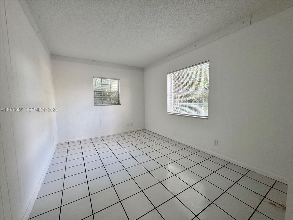 Photo of 4140 Woodside Dr #107, Coral Springs, FL 33065 (MLS # A11976955)