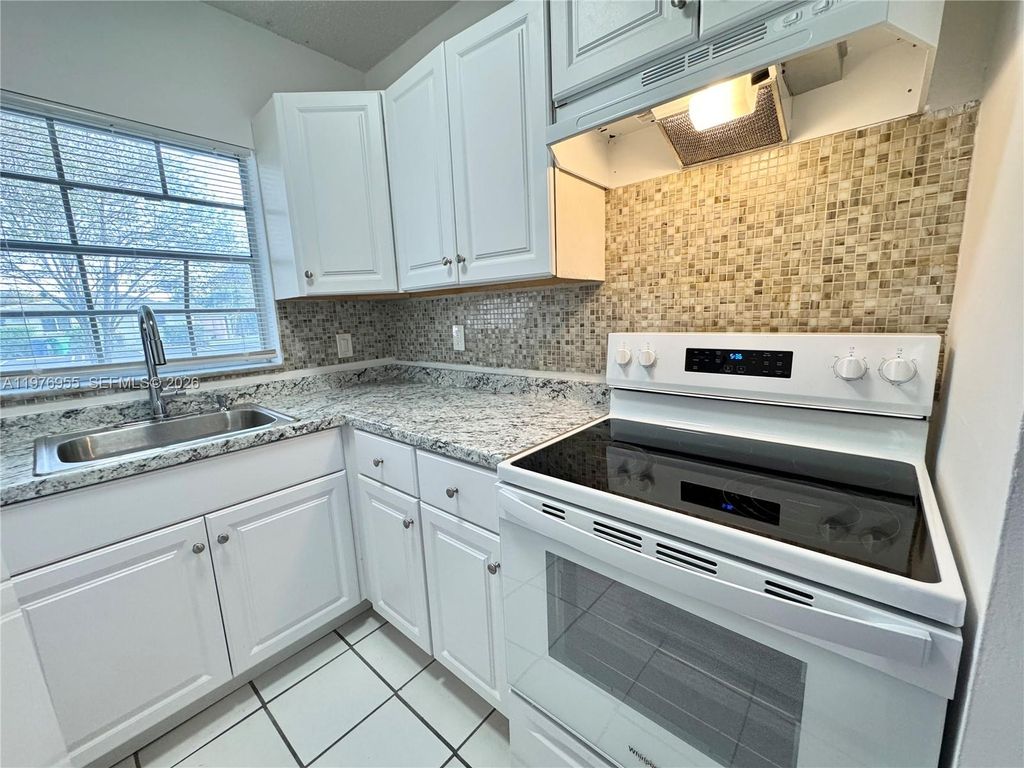 Photo of 4140 Woodside Dr #107, Coral Springs, FL 33065 (MLS # A11976955)