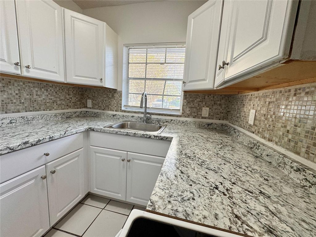 Photo of 4140 Woodside Dr #107, Coral Springs, FL 33065 (MLS # A11976955)