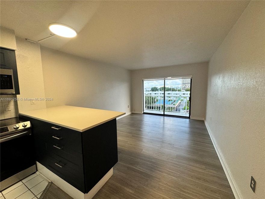 Live Waterfront! Amazing property with breathtaking sunrises and sunsets, located on a quiet street east of Biscayne. This spacious 1BR/2BA has been beautifully remodeled to perfection. Features include a brand-new kitchen with quartz countertops, new appliances, and sleek new floors throughout. Enjoy expansive views, a huge master suite, and the serenity of waterfront living. Whether you're looking for a stunning home or a great investment, this property offers the best of both worlds! Send your offer today—this one won't last!
