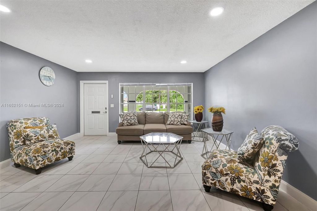 Photo of 711 SE Floresta Dr, Port Saint Lucie, FL 34983 (MLS # A11652151)