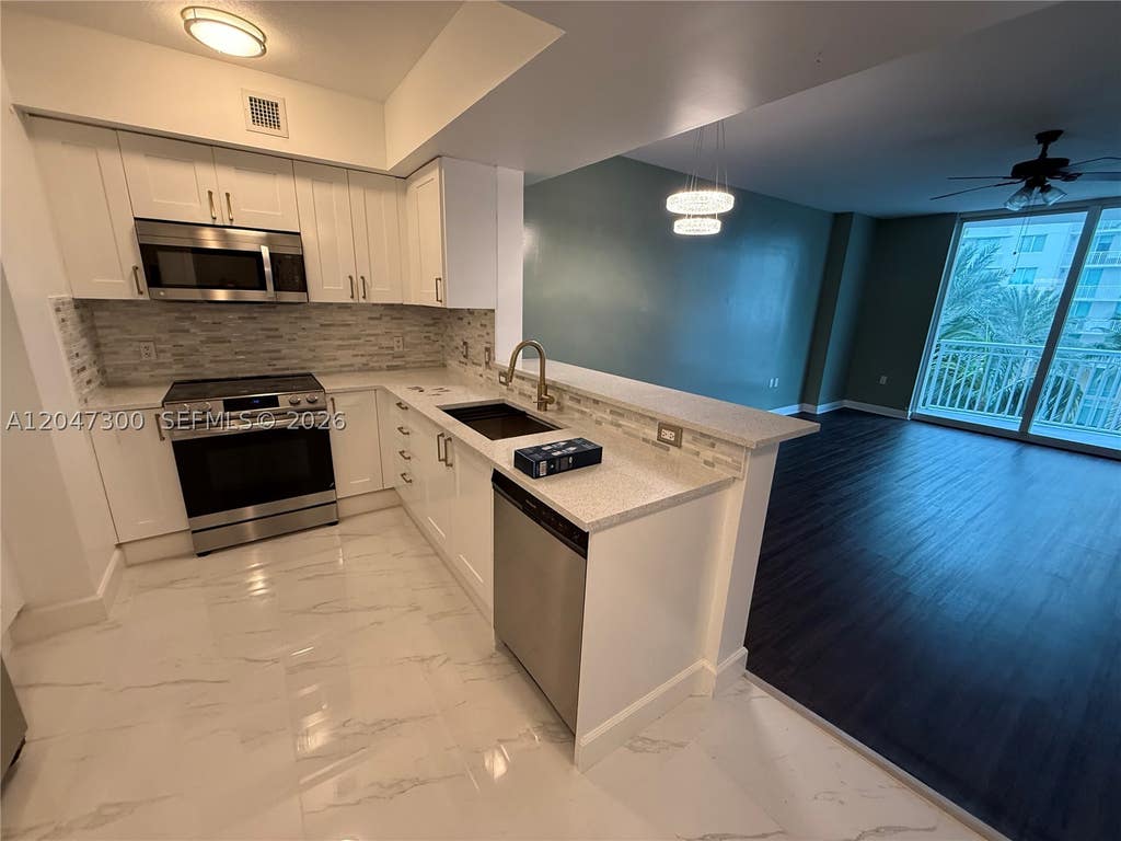 Photo of 1745 E Hallandale Beach Blvd #304W, Hallandale Beach, FL 33009 (MLS # A12047300)
