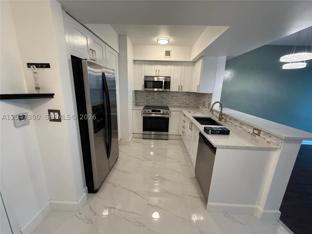 Photo of 1745 E Hallandale Beach Blvd #304W, Hallandale Beach, FL 33009 (MLS # A12047300)