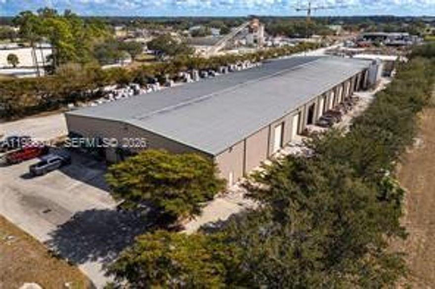 Located in the path of progress, this established paver manufacturing facility—home to Gulf Coast Pavers—offers exceptional access and infrastructure on 4.44± acres. The property features a 30,000± square-foot main warehouse/manufacturing facility with office and showroom, equipped with 20 roll-up bay doors, 800-amp 3-phase power, and fenced, lighted outdoor storage. Strategically positioned with easy four-lane highway access to US Hwy 27, Hwy 80, and I-75, the site is centrally located within approximately 30 minutes of Fort Myers and Cape Coral, 2.5 hours to Orlando or Tampa, and 2 hours to Miami/Fort Lauderdale. Location Details: Situated adjacent to the LaBelle Municipal Airport, the property is zoned Heavy Industrial (I-2). In addition to the main facility. Property Highlights: • 6 offices, showroom, and conference room • 20 bay doors (10 west side / 10 east side) • 800-amp 3-phase electric service • 4 restrooms plus kitchen and breakroom • Entire 4.44± acres fully fenced with 8-foot security fencing (excluding parking area) • Extensive outdoor storage capacity