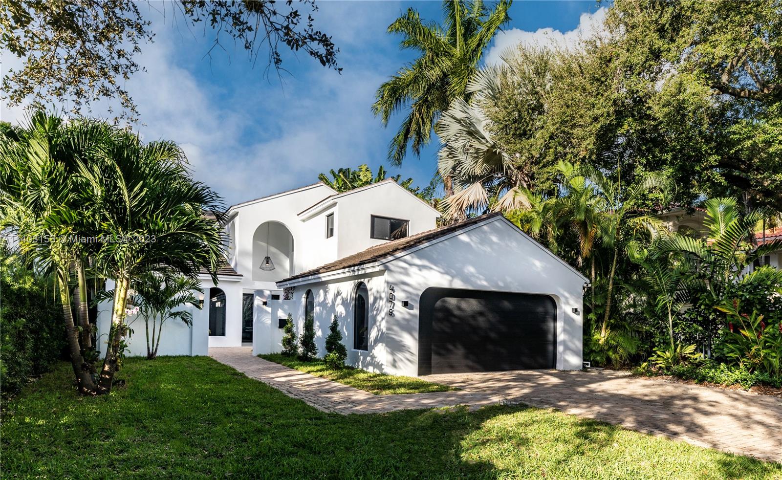 Exquisitely and newly renovated turnkey home in the best South Coconut Grove location on a coveted street. With the highest-end custom finishes and a wonderful open layout, this home is ready to entertain! Features include: custom Italian kitchen with Thermador appliances including a gas range and dual ovens, new impact doors/windows providing light-filled spaces, grand pivot door entrance, wine cellar, European oak flooring, high-end light fixtures with Lutron full home automation, new bathrooms with custom vanities, exotic stone countertops, new MEP systems, all finished to exacting standards. Luxurious spa-like master bath with steam shower, freestanding tub overlooking your balcony, lush backyard and heated salt water pool. Over 4,000 total square feet per survey. Not in a flood zone.