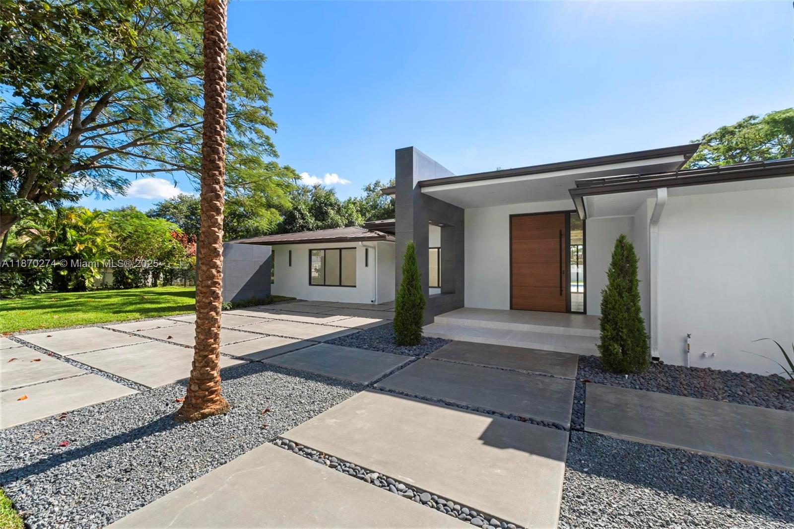 This modern Pinecrest masterpiece offers 3,406 sq. ft. of luxury living with 5 bedrooms and 4.5 bathrooms, featuring an Italian-inspired kitchen with Thermador appliances, imported Italian and Spanish finishes, custom closets, and premium doors. Set on a 20,000 sq. ft. landscaped lot with fruit trees, it includes a resort-style pool, travertine patio, and summer kitchen under a sleek aluminum roof. Designed for elegance and durability, the home also features ES impact windows and doors, a prewired IT room, two energy-efficient AC units, and a new septic system.