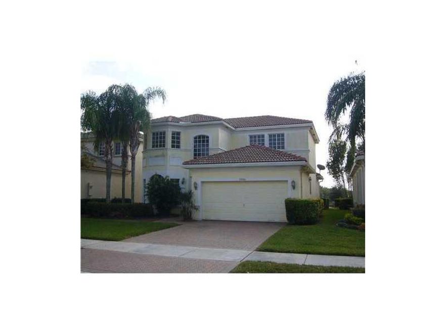 Beautiful 4 Bed 2.5 Bath LAKEFRONT home with huge patio located in one of the best gated communities in Pembroke Pines, Laguna Isles! Master Suite on the lower level! 3 REALLY HUGE Bedrooms and 2nd Bath PLUS LOFT are upstairs! Wood floor on second floor,  BIG kitchen with Family Room/Breakfast Area, Lake Views! Brick Paver Drive/Patio perfect to entertain family and friends