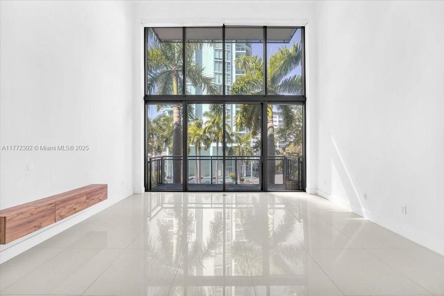 This soaring 20 FT ceiling, 2 floor unit is an impressive 1,700 SF with 2 beds & 2 baths plus a loft. Floor-to-ceiling windows provide ample natural light. This Terra Beachside condo has a modern kitchen with stainless steal appliances, in unit laundry room and pantry, plus 2 balconies with water & garden views. Primary bedroom has a large custom walk-in closet & spa-like bathroom. Loft is perfect for an office, playroom, den, or 3rd bedroom. Resort-style amenities include a zen garden atrium, fitness center, rec/party room, an oversized heated pool, & hot tub. Just steps away from the ocean, the intracoastal, Brittany Bay Park, Alison Park and playground, grocery store, restaurants, & more. Quick drive to South Beach, Design District, & Bal Harbour. Comes with 1 gated garage parking spot.