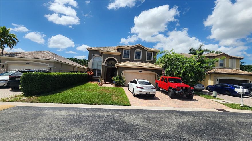 Discover this stunning 5-bedroom, 4-bathroom residence nestled in one of the most desirable neighborhoods in Southwest Miami. With spacious family room and a tastefully remodeled kitchen, outfitted with elegant wood cabinetry and blue  countertops. Both the formal living and dining rooms offer generous space and natural light.  
The spacious master suite features dual closets—including a generous walk-in—and opens onto a large balcony with views of the pool and patio area. Additional highlights include a recently renovated pool (updated 5 years ago), a covered terrace with hurricane shutters, impact-resistant doors, and full window protection throughout.