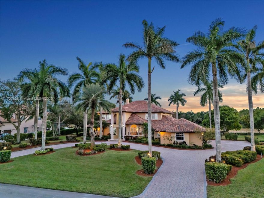 Nestled within the exclusive, gated enclave of Windmill Lake Estates, this extraordinary lakefront/pool estate on 1 acreage offers an exceptional blend of privacy and Luxury, in the heart of Weston. Ideally located near top-tier schools, showcasing an impressive grand entry foyer adorned with exquisite marble flooring that extends throughout the first level. Towering 22-foot ceilings in the family room create a dramatic connection to the space, while a stunning fireplace exudes warmth and grandeur. The gourmet kitchen features a spacious breakfast area, a bar, perfect for hosting gatherings. This home boasts 6 lavish suites, den, private office and 5 full bathrooms. A game room provide space for both work and play, Roof 2020, A/C's 2021. Private covered patio with spectacular lake views.