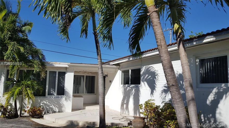 Beautiful Home sitting on a large corner lot with 3 bedrooms, 2 full baths. House has a circular driveway with tropical palm trees decorating the landscaping.  Nice and clean interior with ample and open floor plan with large white shiny tiles, hurricane impact windows and doors. Large rooms and bathrooms, this home has a lovely family room and all the living areas are very spacious and open. Large laundry room with plenty of storage,  sprinkler system, alarm, fruit trees.  Near shopping areas,  beaches,  Aventura, easy access to I-95 and schools.