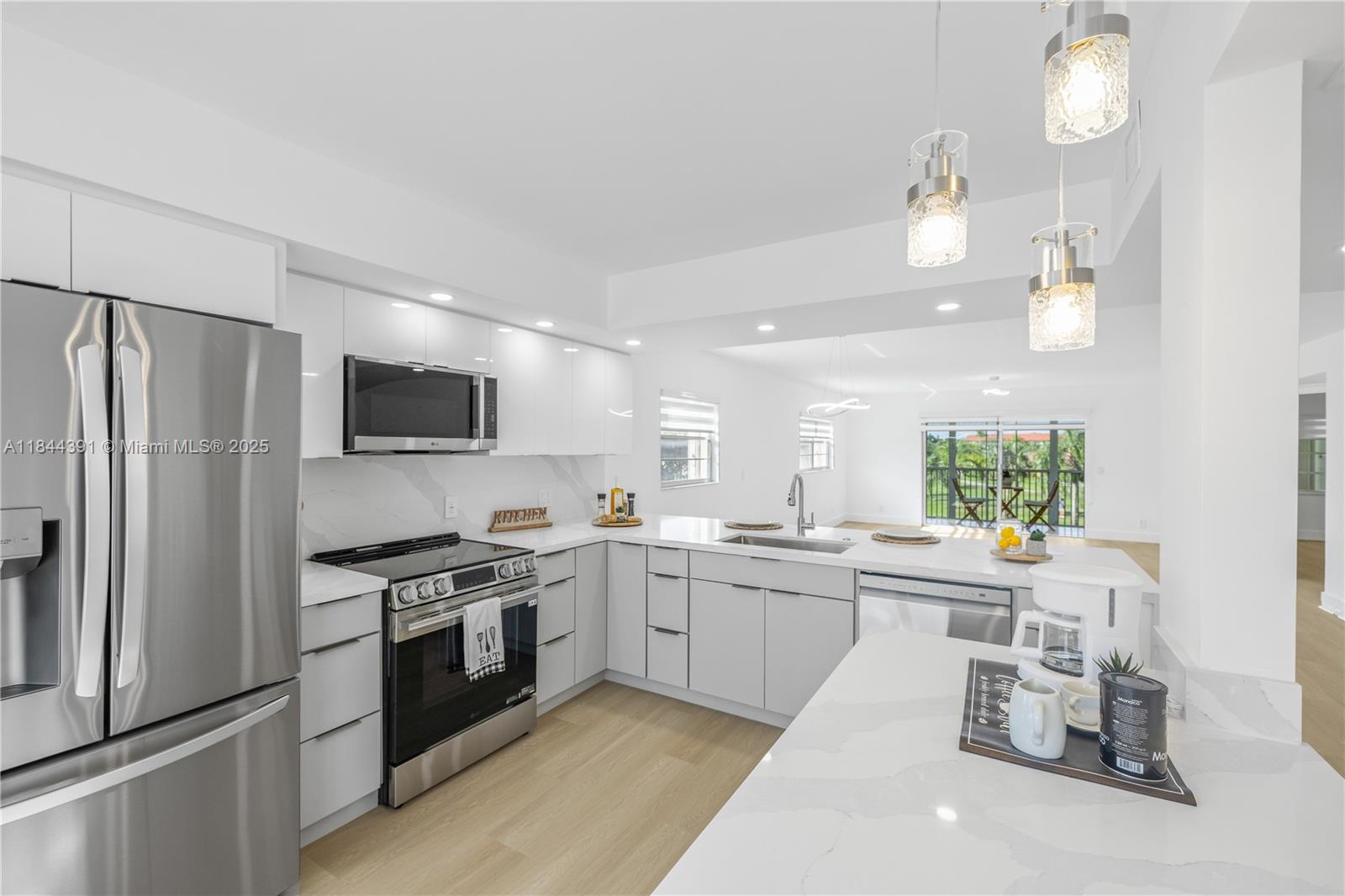 Stunning Fully Remodeled Corner Unit. Spacious & Elegant! Offering the perfect blend of luxury, comfort and modern design. Located in a prime location with a beautiful golf view. Brand New Open concept kitchen with custom ceiling-height wood cabinets, plenty of storage and style, Quartz countertops with a waterfall edge, plus a cozy breakfast area. Stainless Steel Appliances. LED lighting, Brand new waterproof vinyl flooring throughout, Brand New AC. Modern and large New Bathrooms, New zebra blinds. Oversized master bedroom with a large walk-in closet. Dual Sink. Century Village has 24-hour gated. Expansive clubhouse with fitness center. Heated pools, tennis courts, walking trails. On-site theater, billiards, and card rooms. Complimentary shuttle service, social clubs, and more!