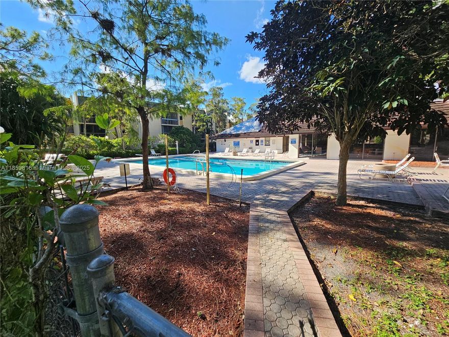 For investors seeking an excellent opportunity, this 1,068 sq ft condo is priced to sell. This spacious 2-bedroom, 2-bathroom unit offers a very light and airy feel, featuring high ceilings and large white tile throughout. Enjoy the convenience of an in-unit laundry room with a washer and dryer, along with a balcony that provides a peaceful, park-like view. The building has an elevator and residents have access to a community pool. This property is currently tenant-occupied, offering immediate rental income for a seamless investment. Please note that short-term rentals are not permitted.