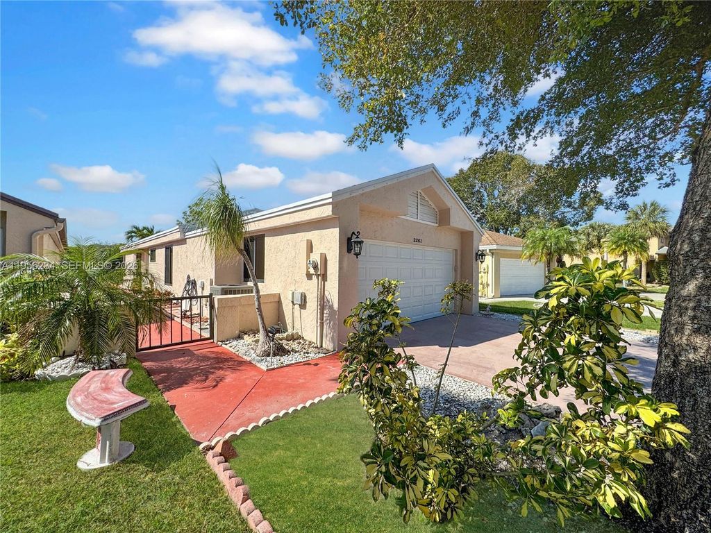 Photo of 2261 NW 34th Ter, Coconut Creek, FL 33066 (MLS # A11956234)