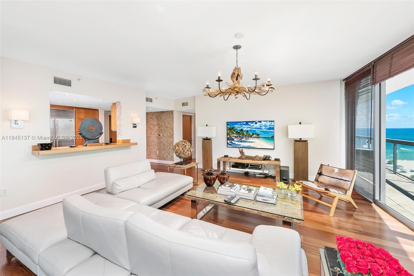 Enjoy sweeping views of South Beach, the Atlantic Ocean, and Downtown Miami from this stunning 2-bedroom, 2-bath residence with coveted southern exposure. Floor-to-ceiling glass walls bathe the interior in natural light while framing postcard-perfect vistas. Sleek wood flooring runs throughout, complementing the modern open layout. Designed for comfort and style, this home offers generous living space, spacious bedrooms, and spa-inspired bathrooms. Ideally located near top-tier dining, shopping, and entertainment, it's coastal city living at its finest.