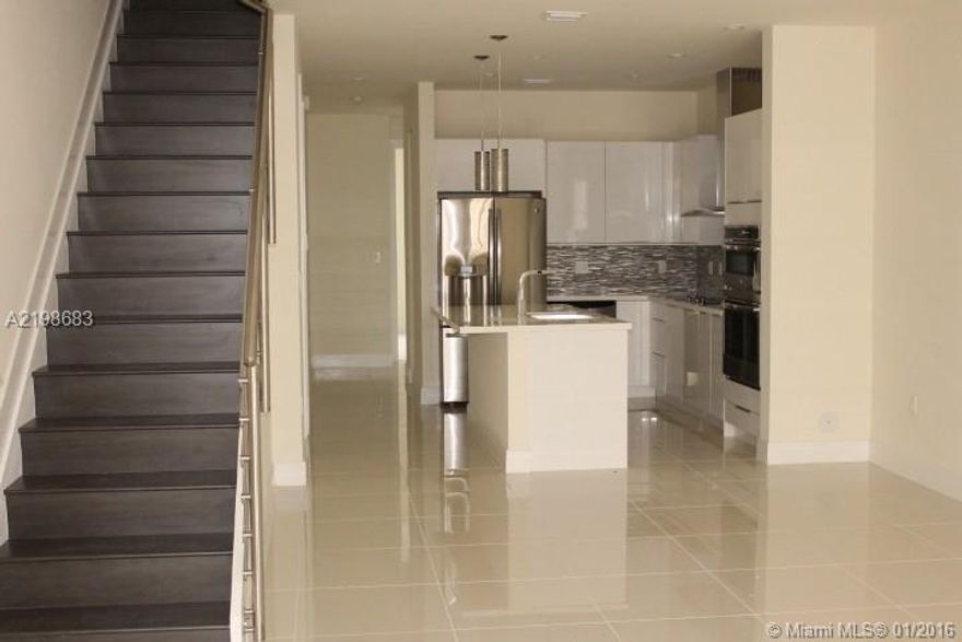 Modern and Brand New 3 bed/3 bath  Condo in Landmark at Doral, A+ rated schools, and just minutes from Dolphin and International Mall. This beautiful unit comes with porcelain floors throughout the first floor, wood on stairs and carpets on second floor.  Many upgrades including wood cabinets,  quartz counter tops, and stainless steel appliances. The community will offer luxury living and amenities.