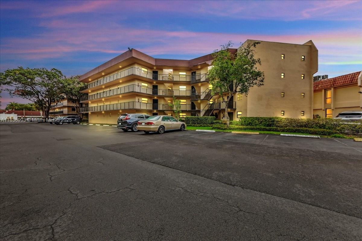 Spacious 2 bed, 2 bath unit featuring neutral-toned walls and ceilings, custom mirrors, and an open living/dining area. Large windows and a sliding glass door to the balcony fill the space with natural light. Enjoy resort-style amenities including a fitness center, clubhouse, pool, hot tub, sauna, and game room. Centrally located—just 10 minutes from Nova Southeastern University, Broward College, and FAU, making it ideal for students and faculty. Only 15 minutes from the beach and Fort Lauderdale Airport. Publix and Starbucks just around the corner. Easy access to major highways.