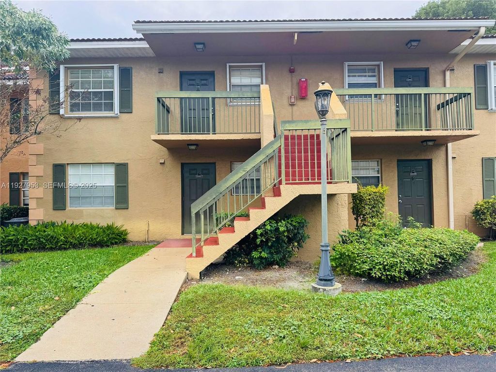 Photo of 10457 NW 8th St #105, Pembroke Pines, FL 33026 (MLS # A11927953)