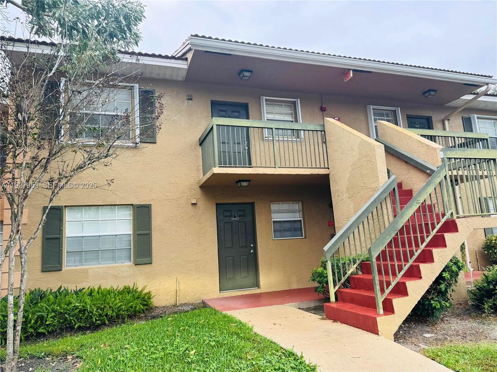 Photo of 10457 NW 8th St #105, Pembroke Pines, FL 33026 (MLS # A11927953)