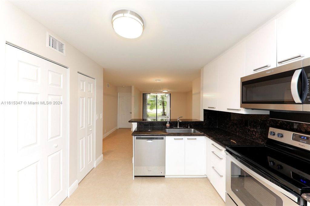 Photo of 10125 W Sunrise Blvd #101, Plantation, FL 33322 (MLS # A11615347)
