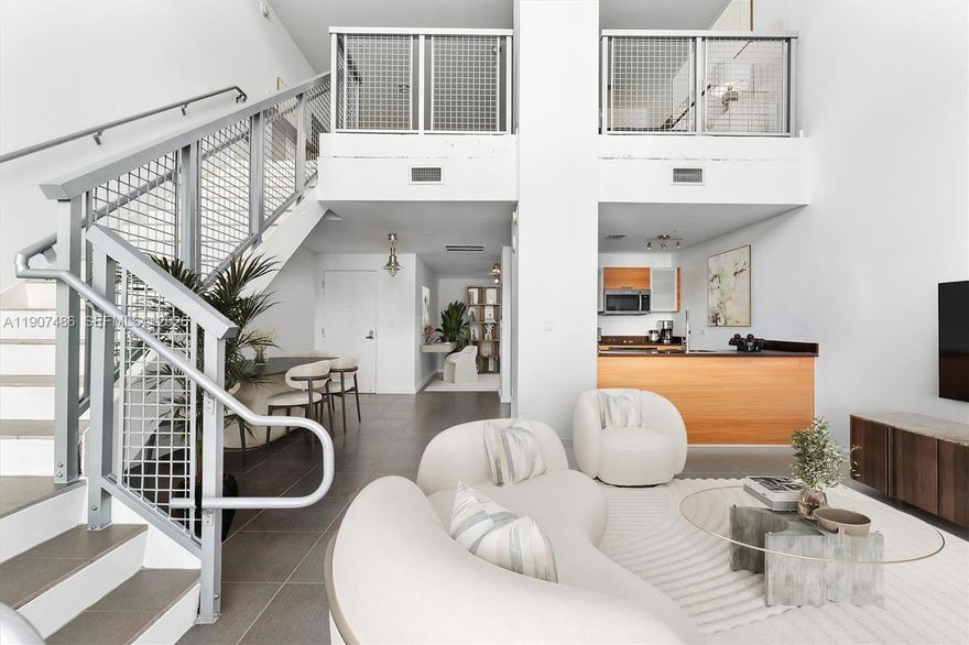 Welcome to Unit M0502 at Four Midtown Condo – a true loft living experience with soaring 30-foot ceilings and expansive windows that bathe the space in natural light. This 1-bedroom plus a versatile second bedroom/den, two-story loft is priced to sell and offers exceptional value in the heart of vibrant Midtown Miami.

On the first floor, you’ll find the flexible second bedroom, currently styled as a home office, offering plenty of potential as a den, guest space, or creative retreat. The floor also features sleek stainless steel kitchen appliances, modern tile flooring, and a spacious terrace perfect for unwinding or hosting friends. Upstairs, the expansive primary bedroom provides privacy and comfort in a serene setting.

4 Midtown is a full-service, pet-friendly condominium boasting a freshly redesigned lobby, a state-of-the-art fitness center, and beautifully updated common areas. Step outside, and you’re just moments from the finest dining, shopping, and nightlife in Midtown, Wynwood, and the Miami Design District. Don’t miss this rare opportunity to own a stunning loft in one of Miami’s hottest neighborhoods!