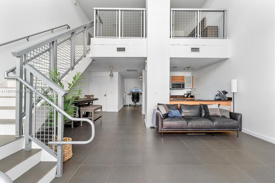 Welcome to Unit M0502 at Four Midtown Condo - Discover an exceptional opportunity to reside or invest in a stunning 1 BEDROOM plus DEN, two-story LOFT that boasts impressive 30-FOOT CEILINGS and an abundance of natural light. Situated in the vibrant heart of MIDTOWN Miami, this residence offers a modern lifestyle with its sleek stainless steel kitchen appliances, a spacious terrace, and stylish tile flooring. 4 Midtown is a full-service condominium that features a newly redesigned lobby, a state-of-the-art fitness center, and beautifully updated common areas, all within a pet-friendly community. Enjoy unparalleled convenience with some of the finest restaurants, shops, and nightlife right at your doorstep in Midtown, Wynwood, and the Miami Design District.