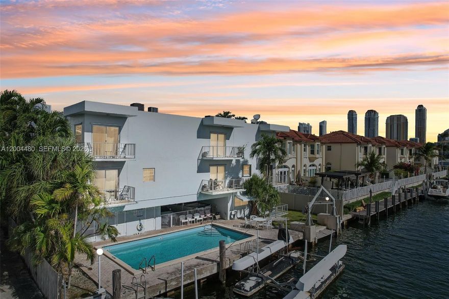 Move-In Ready! Experience this South & Southeast facing Waterfront Corner Condo with two balconies in a boutique building (only 6 units!) in Eastern Shores! This beautifully remodeled 2-story corner unit offers stunning Canal & Intracoastal views. Features include impact windows/doors, luxury finishes, & a bright, spacious layout. Enjoy the pool area, your private 24-ft floating dock (no fixed bridges), and easy access to Oleta River State Park & the Haulover Inlet. Covered parking under the building, with entry on the 2nd floor. Eastern Shores is a premier waterfront community, offering a peaceful, exclusive lifestyle. A must-see for boaters & waterfront living enthusiasts! This is more than a home—it's a Lifestyle! Don’t miss this chance to live the Miami waterfront dream!