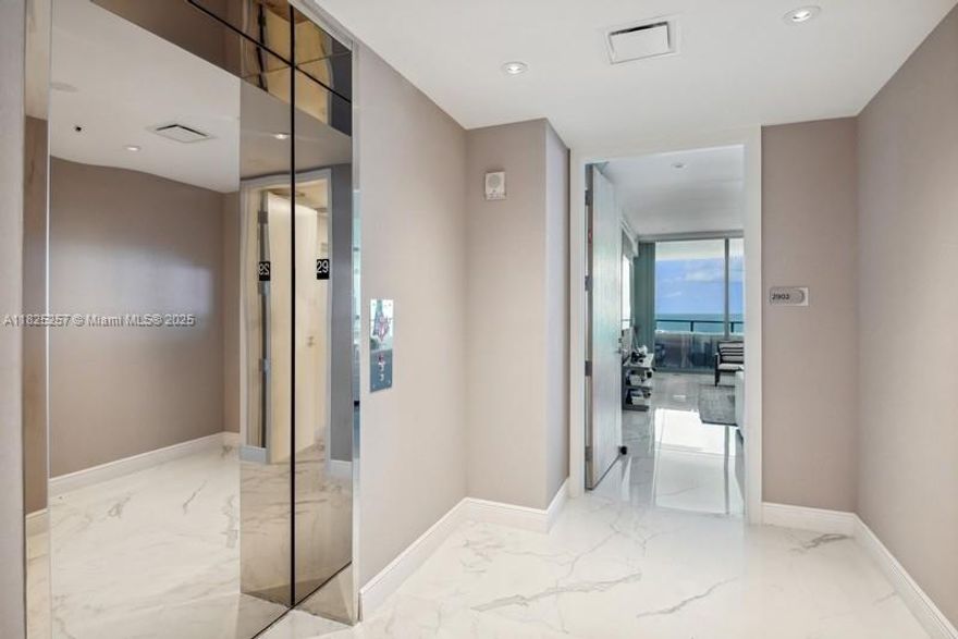 Welcome to Unit 2902 a flow-through, oceanfront luxury retreat on the 29th floor with stunning direct Atlantic and intracoastal views.  Featuring 3 bedrooms with full en-suite bathrooms and a powder room for guests.  The spacious 2,137 sq. ft. of elegant living space with marble flooring is complemented by two balconies:  one ocean-facing terrace for sunrise views and another overlooking the city skyline for sunsets, totaling approximately 325 sq. ft.  Floor to ceiling windows and private elevator lobby, Italian cabinetry, stone countertops with Gaggenau appliances.  Prime beachfront living within minutes of Aventura Mall and Bal Harbour Shops, and 30 minutes to MIA or FLL airports. Motivated Seller!