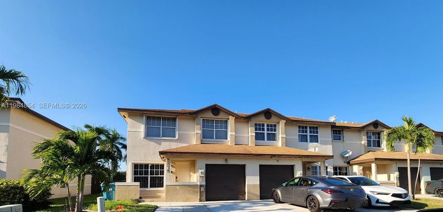 Beautifully maintained 1618 sq ft, corner lot townhome featuring 4 bedrooms and 2.5 bathrooms in a secure gated community. Bright and spacious layout with an open living room and dining area, highlighted by tile flooring, crown molding, zebra blinds, and granite kitchen countertops. Step outside to enjoy a private tiled patio with pergola, perfect for relaxing or entertaining family and friends. Upstairs offer wood flooring throughout 4 generously sized bedrooms, including the master bedroom with an ensuite bathroom. This townhome is conveniently located just down the street from the Hard Rock Stadium with easy access to the Florida Turnpike. This move-in ready townhome delivers if you are looking for your first home, forever home, or a smart investment property. Seller is offering $5,000.00 credit towards buyer's closing.