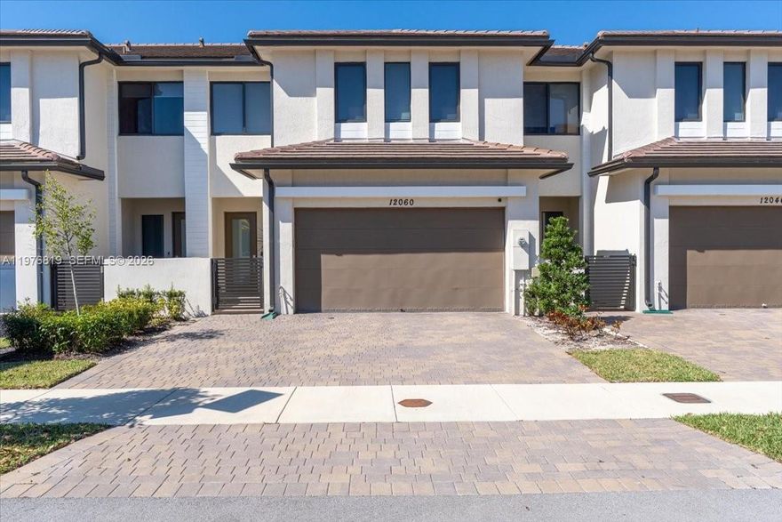 Luxury, modern townhouse with 4 beds/3.5 baths in the boutique, gated, master-planned community Centris by Lennar. This exceptional residence presents an open, light-filled layout with premium architectural details, designer finishes, and seamless indoor-outdoor living — perfect for today’s sophisticated lifestyle. Spacious living areas with high ceilings ideal for entertaining. Gourmet kitchen with premium cascade quartz counters, Wolf/Subzero appliances and wine cooler. Private outdoor space for relaxation and al fresco dining with custom turf and views to the community garden. Two-car garage with storage and additional 3 driveway parking spaces. Modern title on 1st floor, vinyl on 2nd floor. All bedrooms and laundry are on the 2nd floor. Custom Container Store closets. Electric
water heater and impact windows throughout. Centris offers a swimming pool, a barbecue gazebo, a children's playground, a landscaped park with walking paths for daily strolls and pet play. Located in one of Miami’s most desirable neighborhoods, this home is conveniently located by US1 offering proximity to an extraordinary array of conveniences. Minutes to The Falls, Dadeland Station, Dadeland Mall, supermarkets, boutiques, cafes and scenic parks like Matheson Hammock and Chapman Field, perfect for boating, biking, or lakeside picnics. Schedule your showing today!