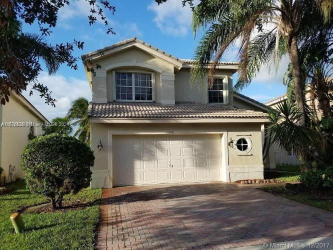 BACK ON THE MARKET. Lakefront opportunity!!! two-story home in one of the best cities in South Florida: Miramar. quiet neighborhood featuring 4 bedrooms and 3 baths, with 1 bedroom and a full bath ground level spacious floor plan, large open kitchen and family room area, double height ceiling in dining/living rooms, grand master bedroom on the second floor. spectacular paved terrace overlooking the lake with lots of natural light that gives it a bright, fresh feeling. enjoy the lake’s views from almost every corner of this home: master bedroom/bath, living-dining-kitchen & family room. two-car garage with extra carport, inside laundry room, extra office room (under permit), Spanish style porcelain on ground floors and wood on second, accordion hurricane shutters.