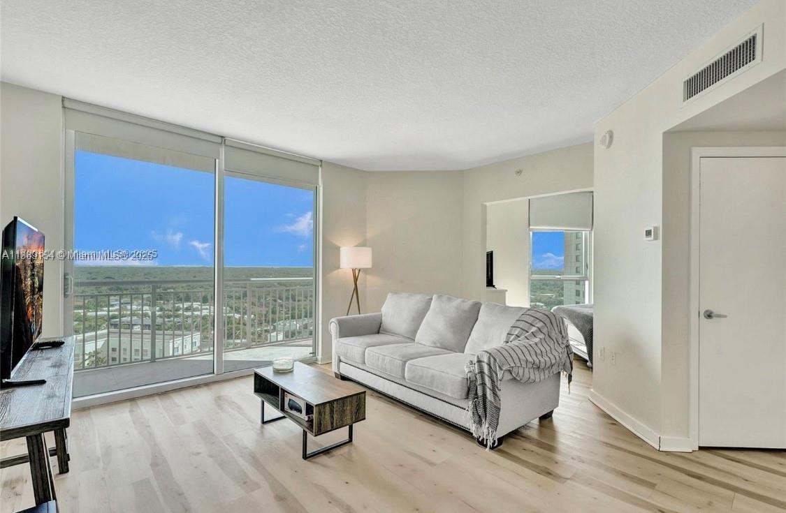 Step into a light-filled retreat in the sky! This 1 bed / 1 bath, 657 sq ft residence showcases sweeping skyline and ocean views, modern laminated floors, and a sleek kitchen with stainless steel appliances. Enjoy effortless living with cable, WiFi, and water included. A rare feature: 2 parking spaces for 2 vehicles—1 assigned + 1 valet. Just steps from Publix, Dadeland Mall, Metro Rail, and Miami’s best dining. Full-service amenities—concierge, pools, fitness center, valet, and more—complete the lifestyle. Stylish, connected, and simply irresistible.
