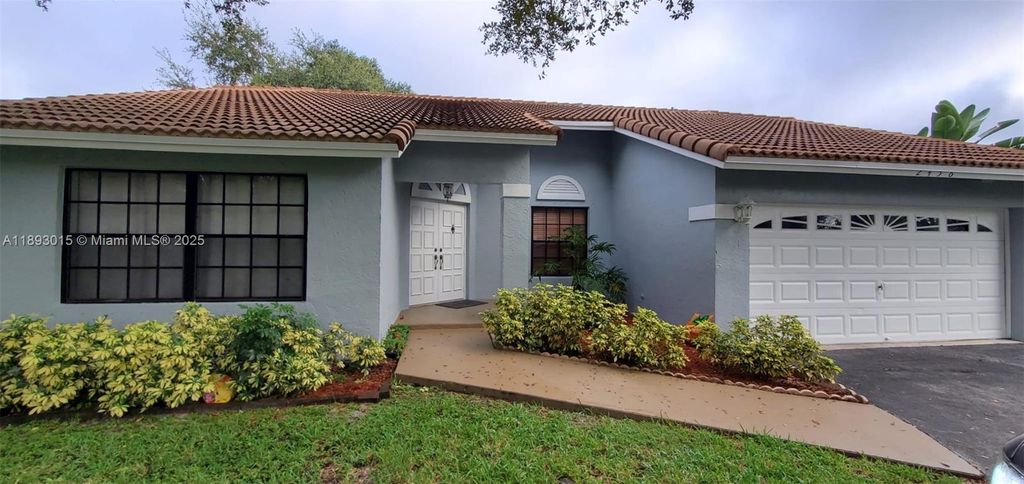 Photo of 2456 NW 97th Ln, Coral Springs, FL 33065 (MLS # A11893015)